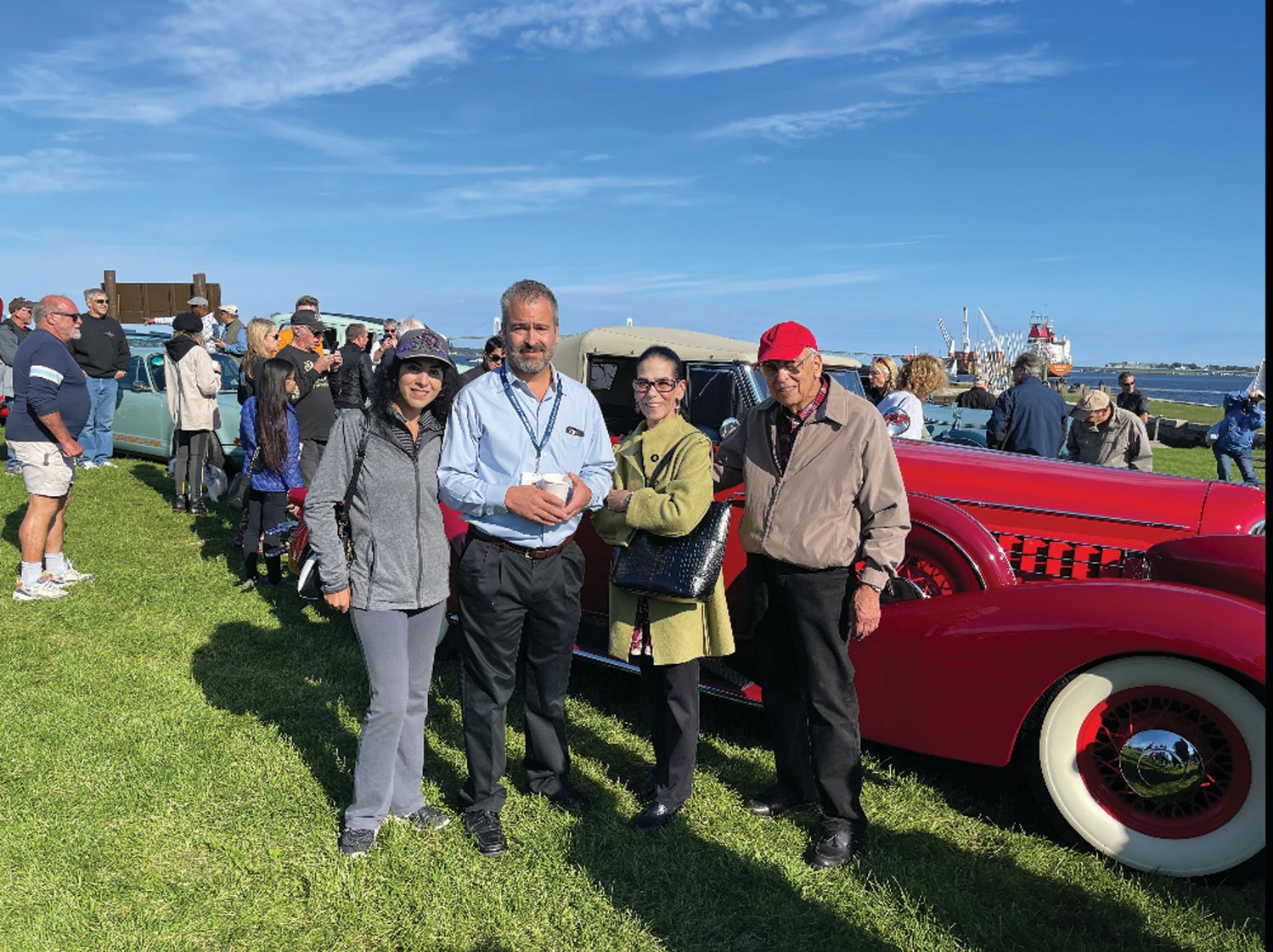 SHOW STOPPER: John Ricci drove his 1934 Cadillac to Fort Adams on Saturday, Oct. 2, where he lined up with other classic automobiles prior to a parade that ended on Bellevue Avenue in Newport. Ricci posed for a photo with his family and the car.